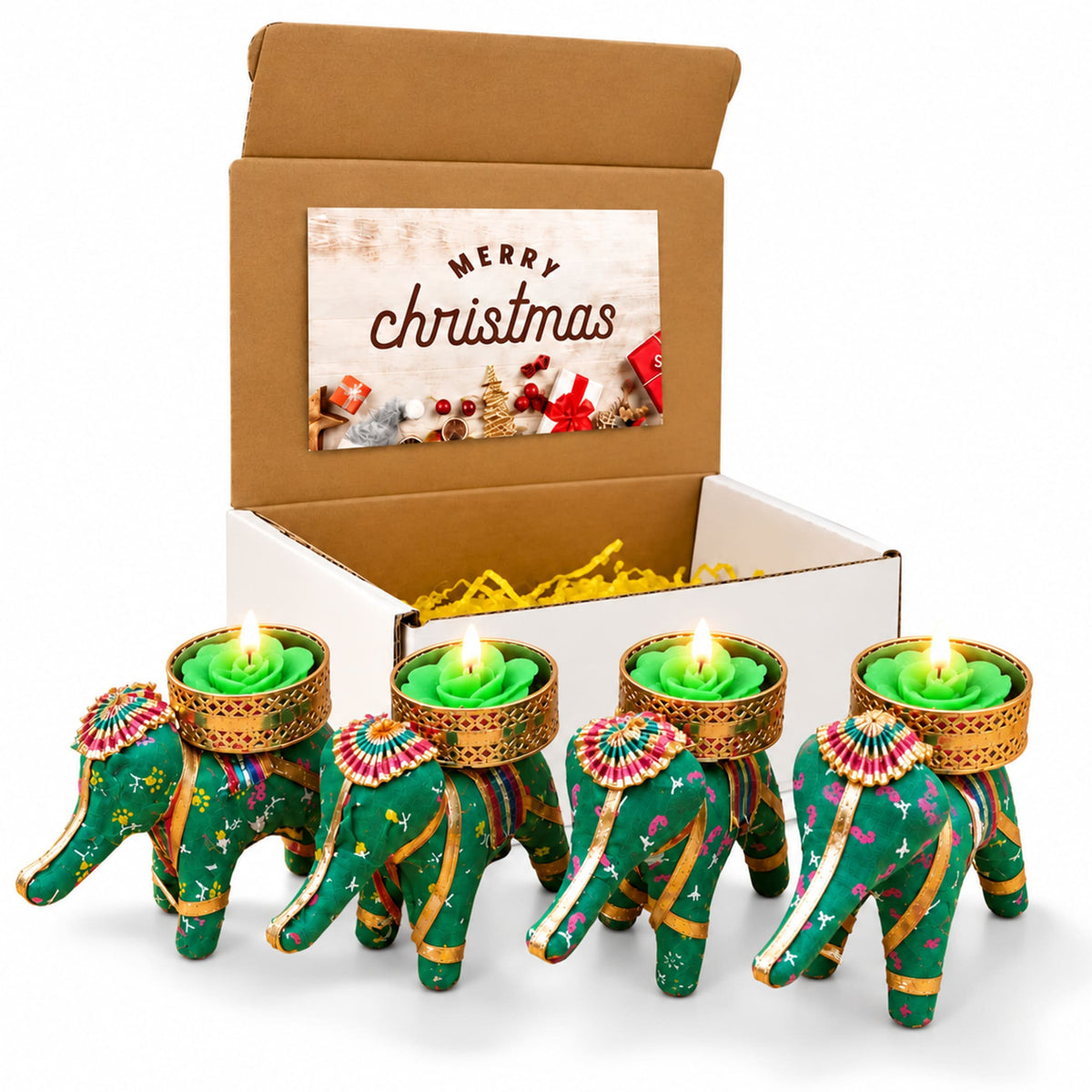 Four green elephant-shaped tealight candle holders with gold pink accents holding lit green rose candles for festive gifting