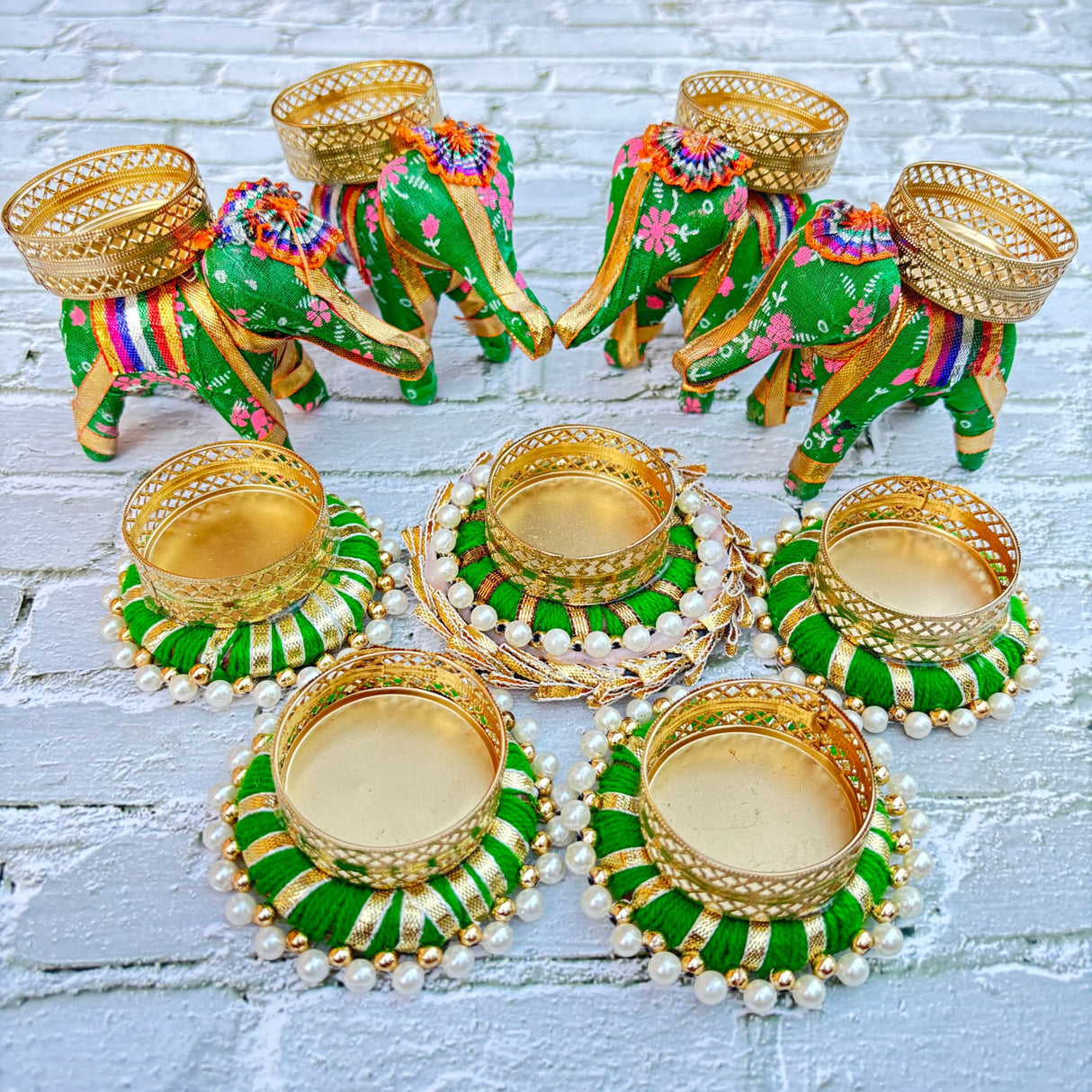 Green and gold decorative elephant and tealight candle holder set for festive home decor