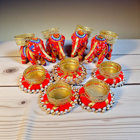 Red elephant-shaped tea light holders with gold details for Diwali and festive home decor