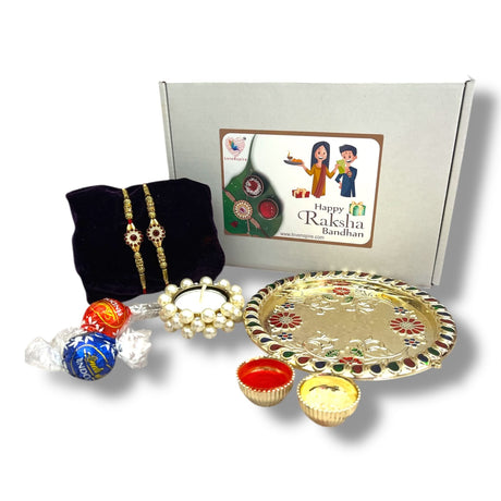 Raksha Bandhan gift set with floral Rakhi, traditional Puja plate, and accessories