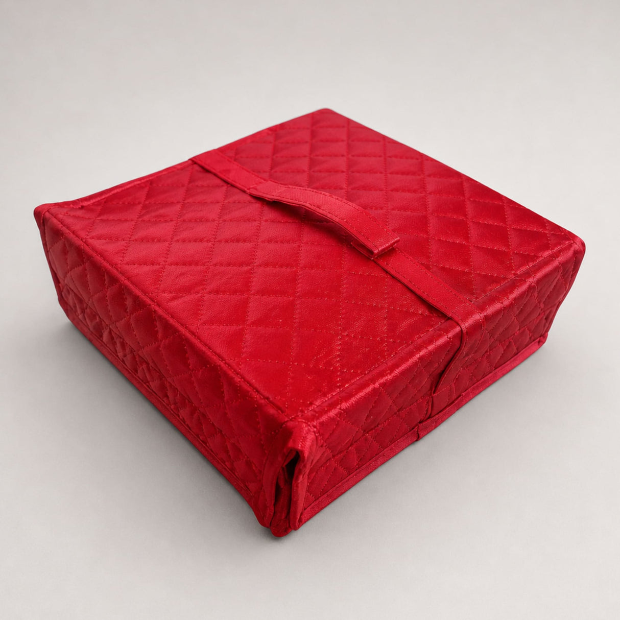 Red quilted fabric storage box with matching strap closure handmade jewelry organizer for travel and vanity use