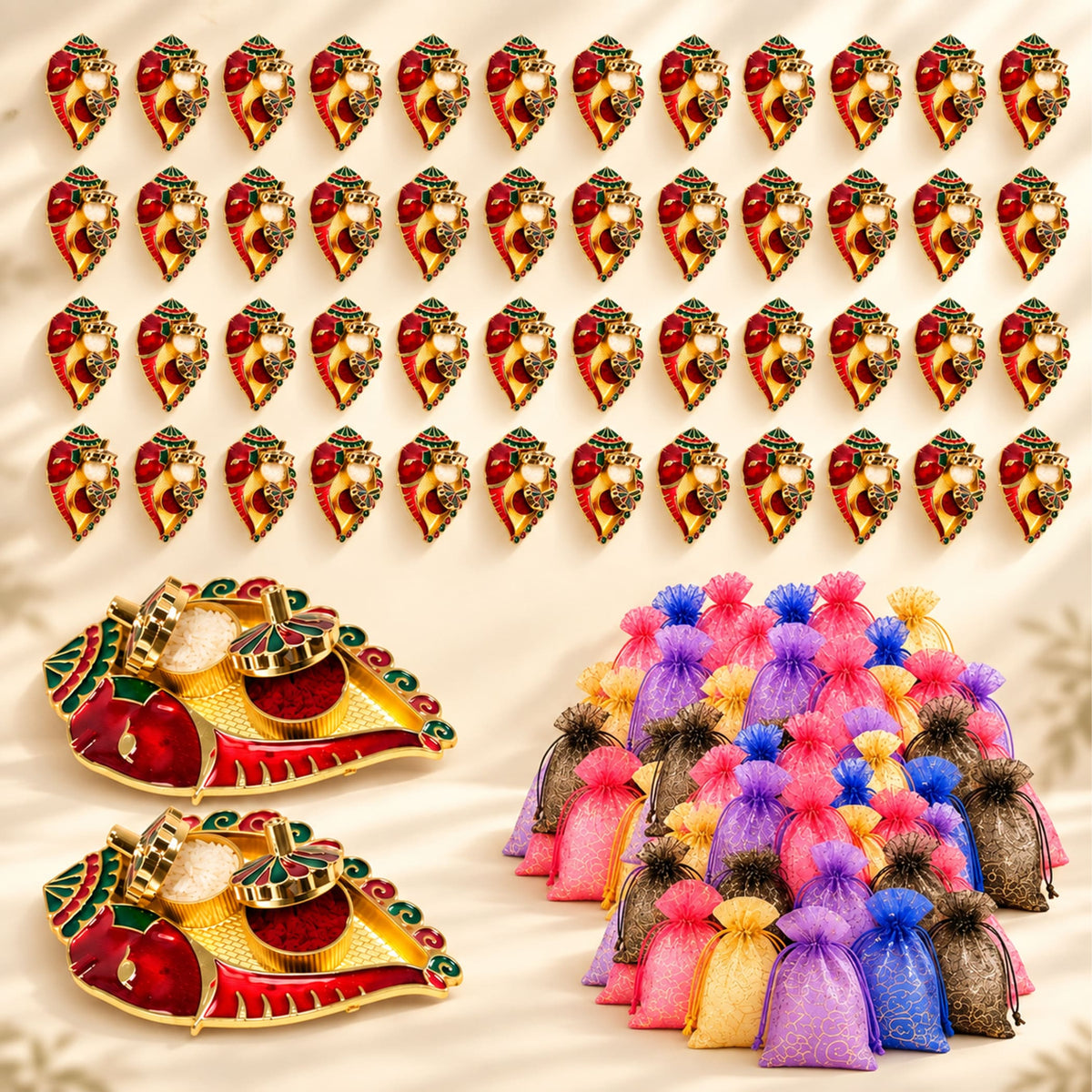 Red and gold ornate ganesha-shaped diya holders with intricate detailing for decorative pooja thali and return gifts