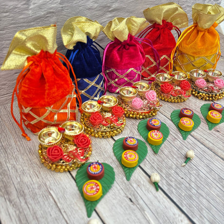 Colorful drawstring pouches and decorative gift sets for Ganesha Chaturthi and Diwali celebrations