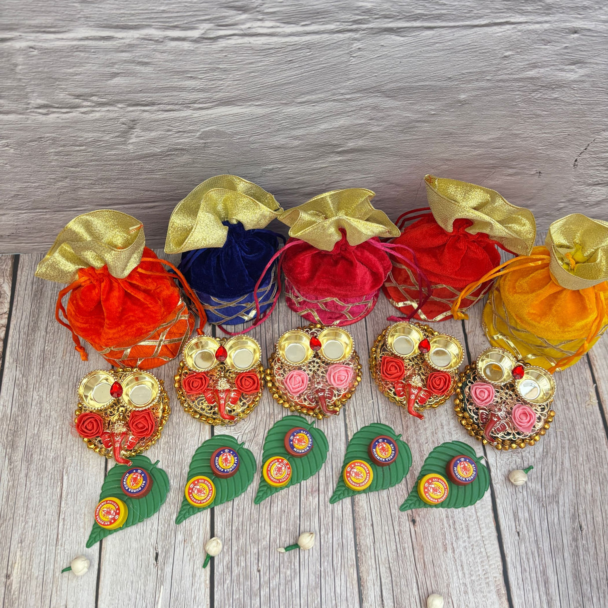 Colorful decorative gift pouches with festive embellishments for Hindu celebrations