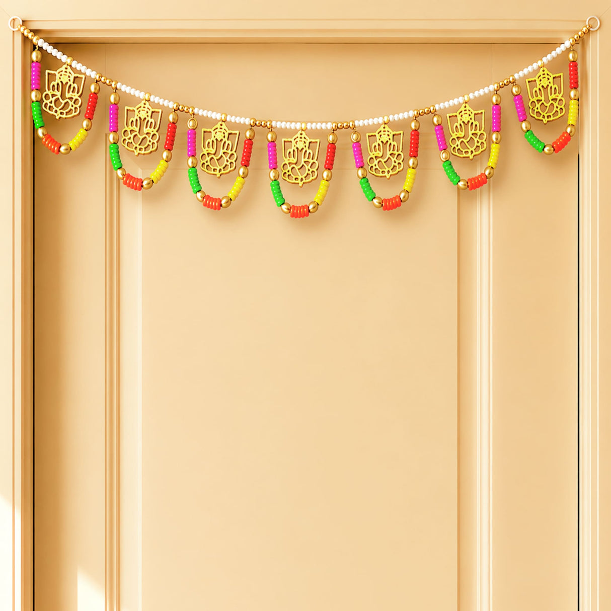 A vibrant gold ganesha multicolor bead door toran 3.5 ft with red green yellow and pink beads for festive decor