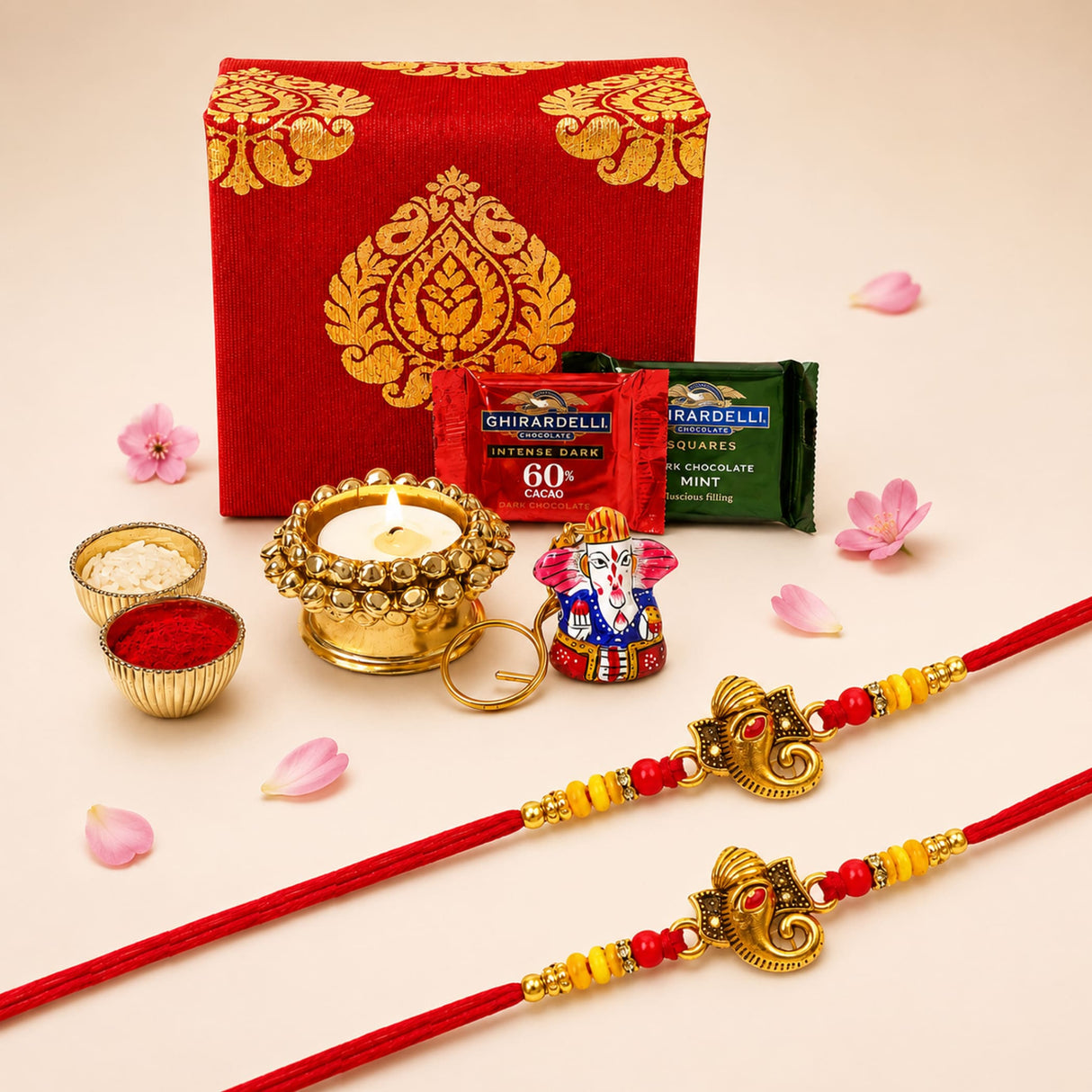 Red and gold ganesha-themed handmade rakhi with red and yellow beads in raksha bandhan brocade gift box hamper
