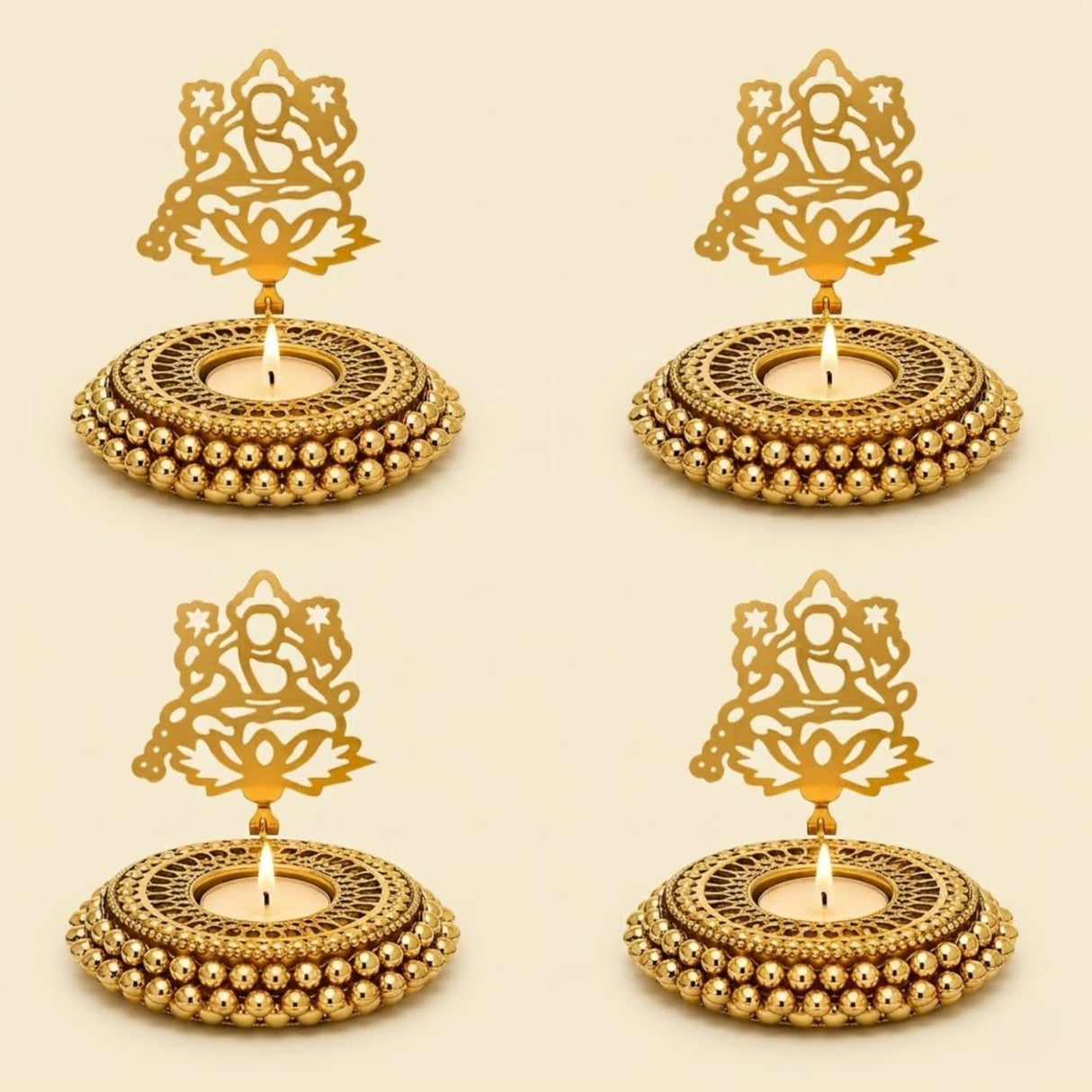 Golden ornate metal tealight candle holders with intricate cut-out designs and beaded edges for festive decor