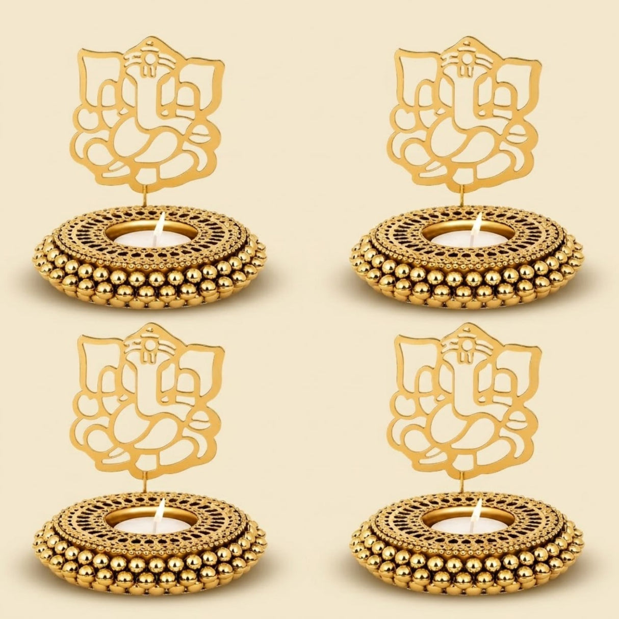 Golden ganesha-themed tealight candle holders with intricate cut-out designs and beaded edges for festive decor
