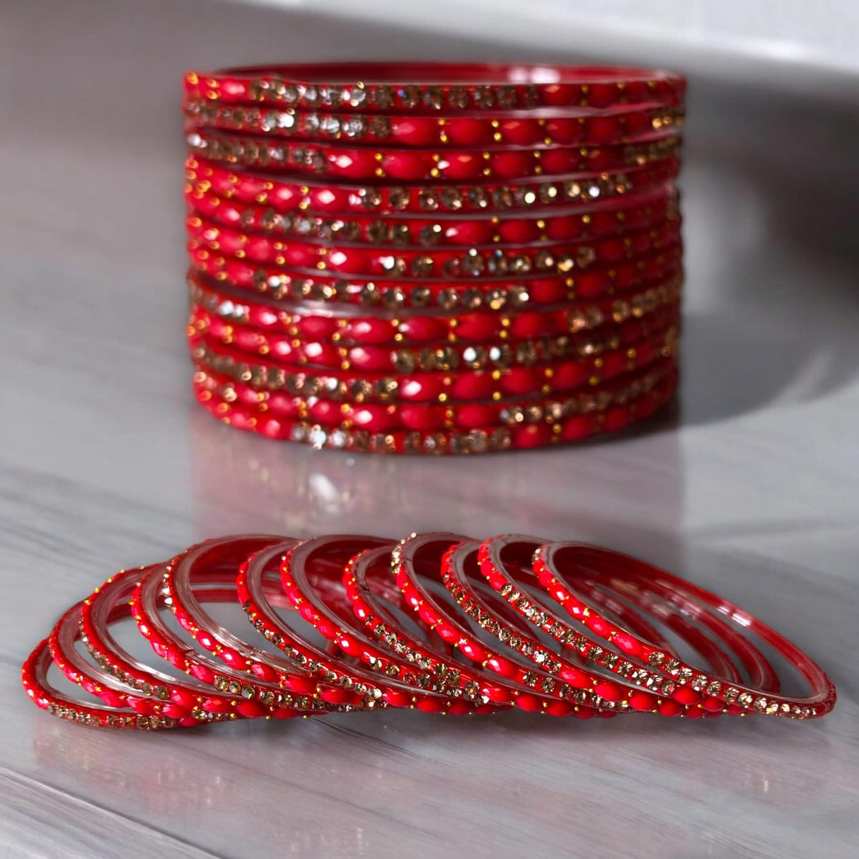 Red and gold jeweled glass bangles set for Indian ethnic wedding and festival wear