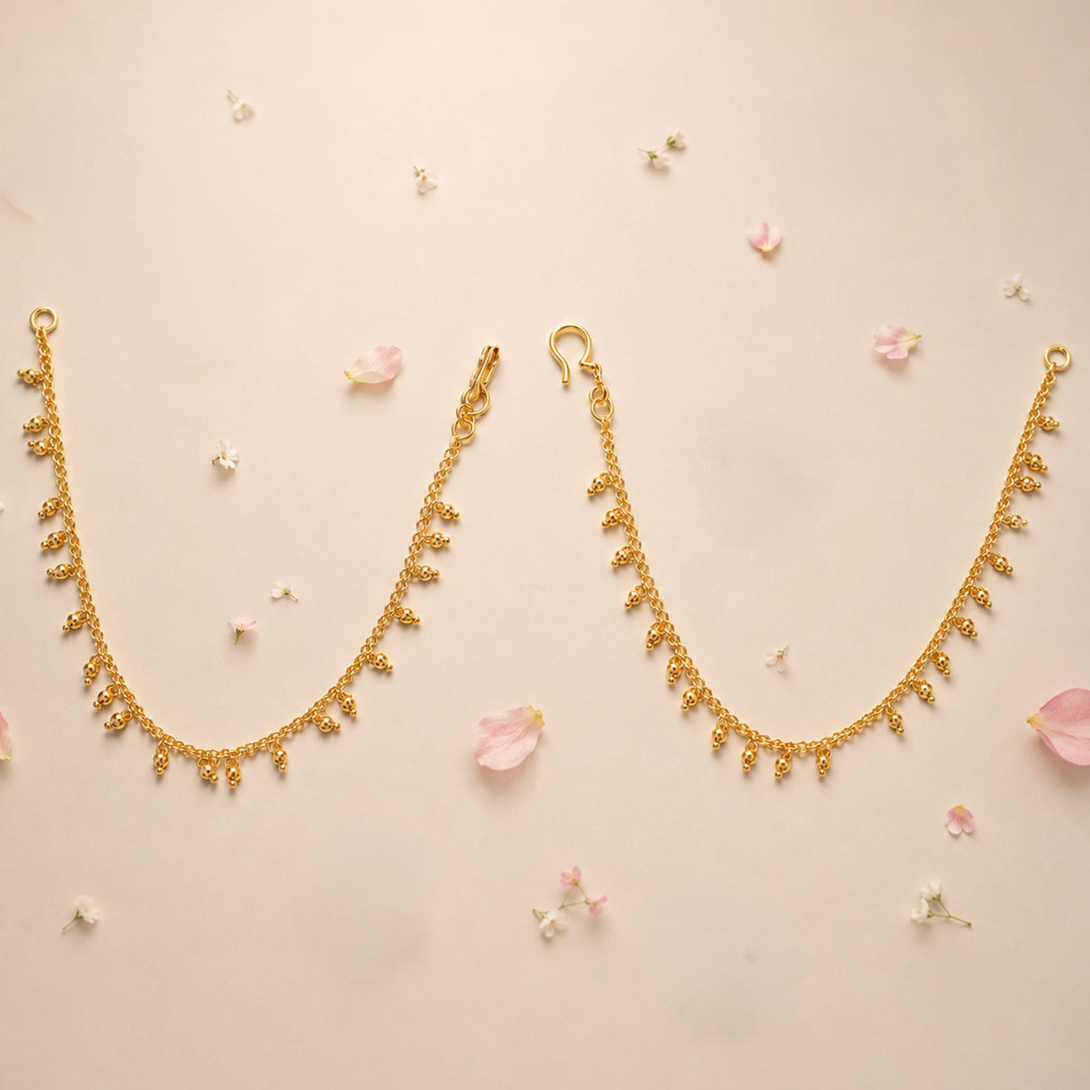 Traditional gold tone ear chains for women with delicate dangling floral charms elegant indian bridal jewelry accessory