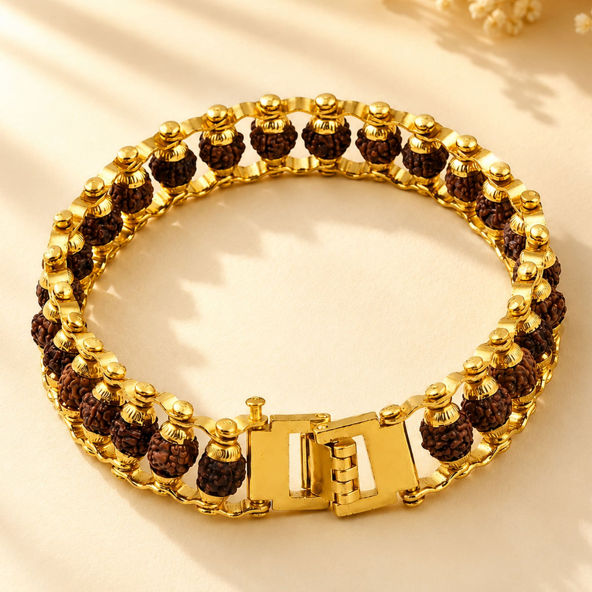 Gold-plated 5 face original rudraksha beads bracelet for men with dark brown textured beads and polished metallic links