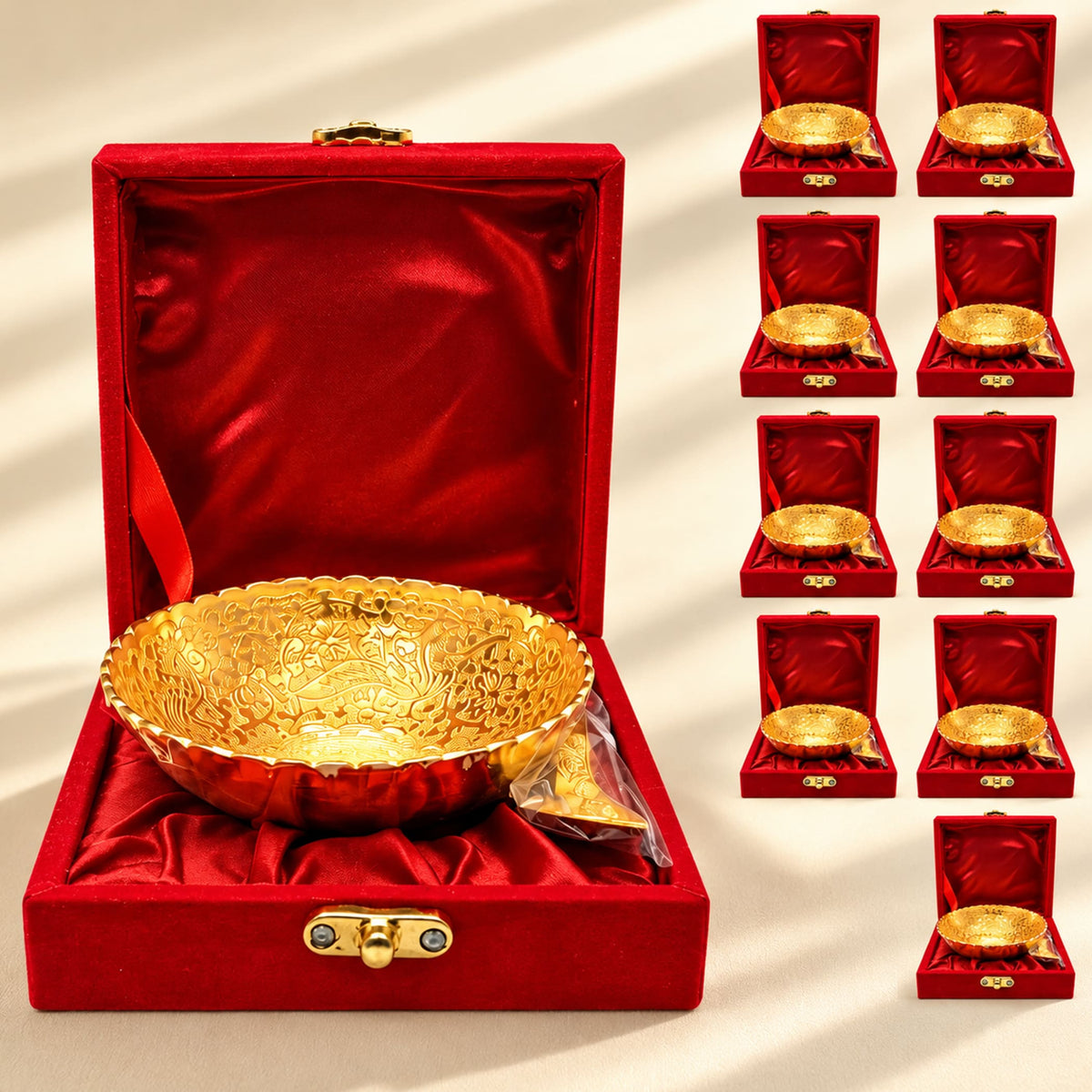Golden ornate german silver bowl in a red velvet-lined box from a gold-tone dessert serving set for pooja and festive gifts