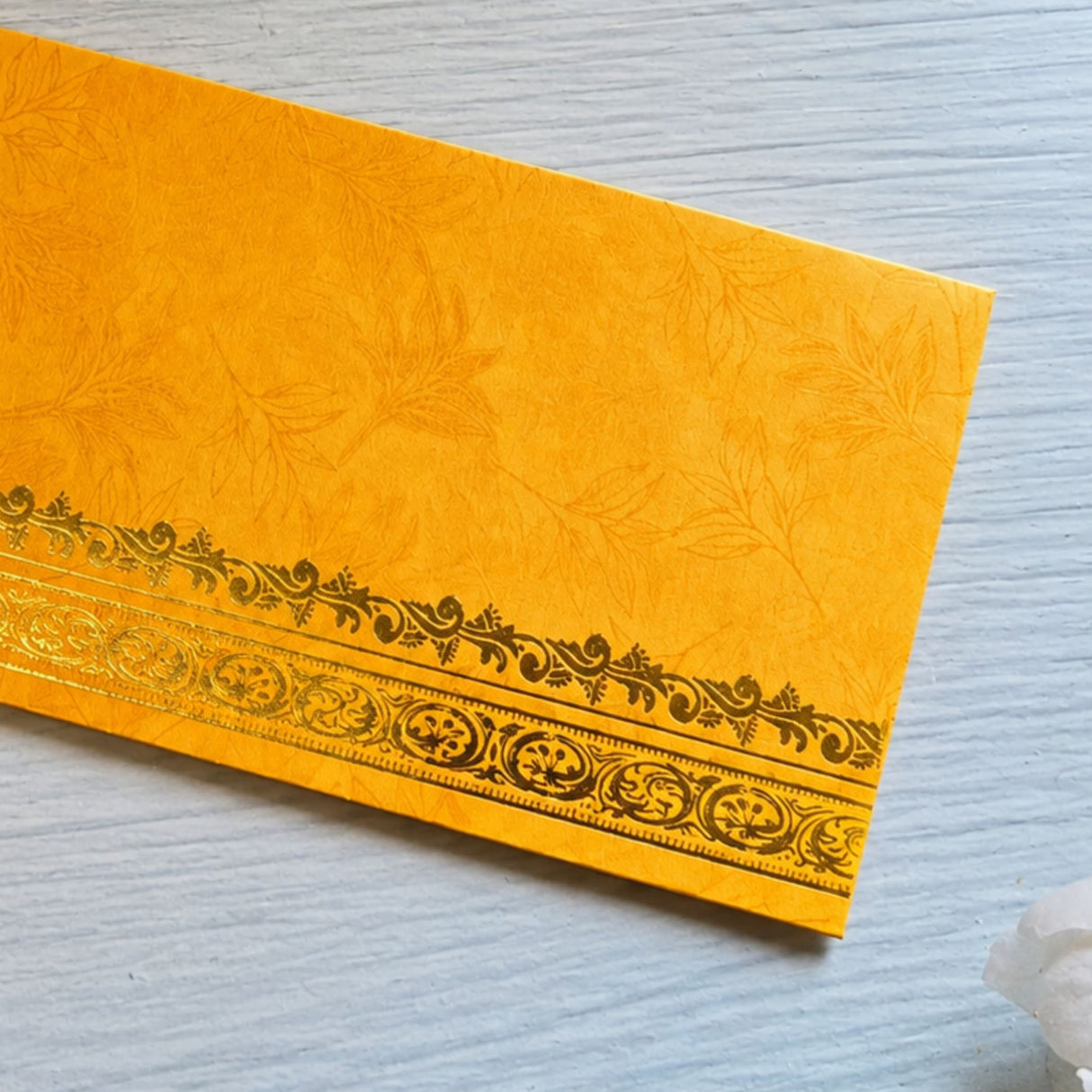 Golden textured money envelope with intricate gold foil border design for indian wedding cash gift holder
