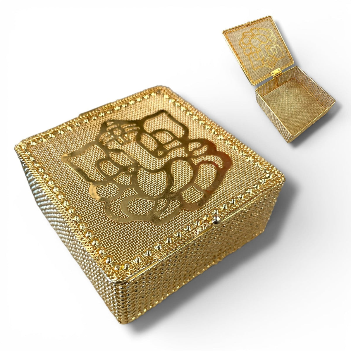 Decorative golden mesh gift box with intricate cut-out ganesha design and beaded edges for festive Indian occasions