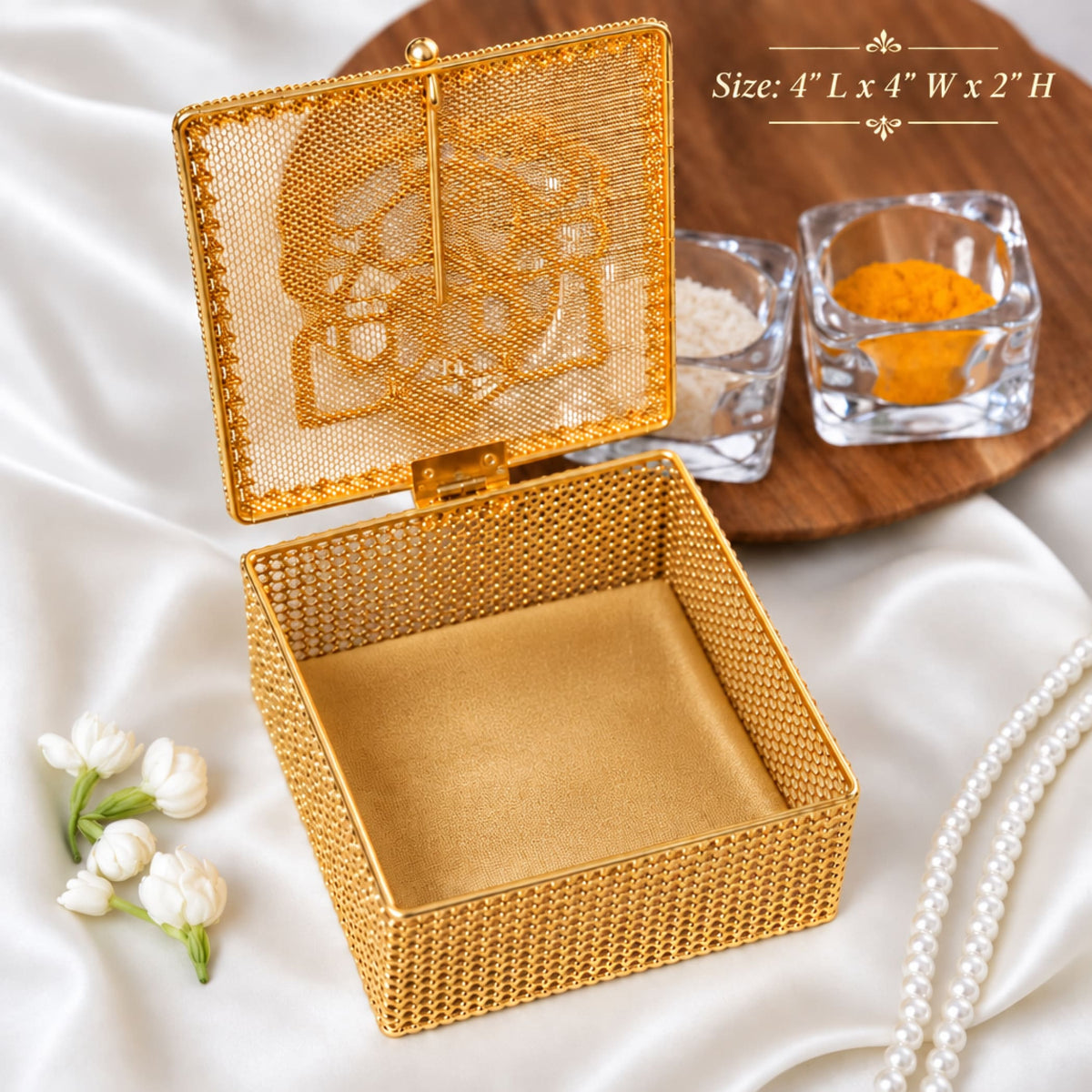 Gold mesh skull jewelry box with hinged lid and textured interior decorative golden gift box with ganesha design