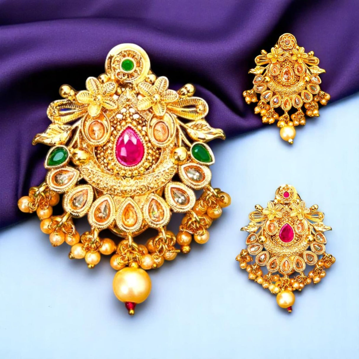 Gold-toned pendant and earrings set with colorful gemstones for Indian saree jewelry