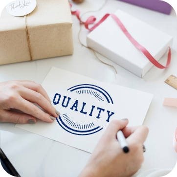 Hand-drawn ’Quality’ logo or stamp design on a white paper.