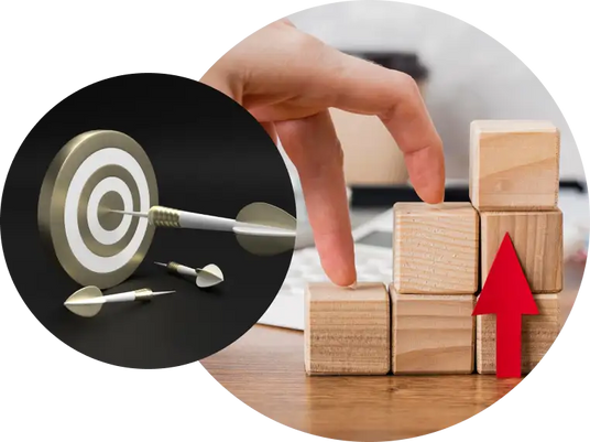 Hand arranging wooden blocks with an arrow and a target board with darts.