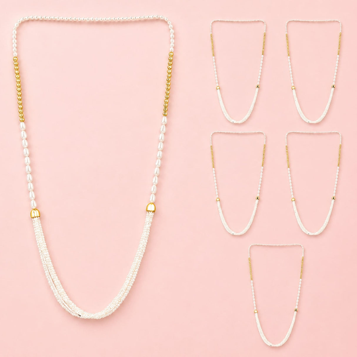 A delicate white beaded Barati Swagat Mala necklace with gold-toned accents and cascading fringe for wedding welcome ceremonies