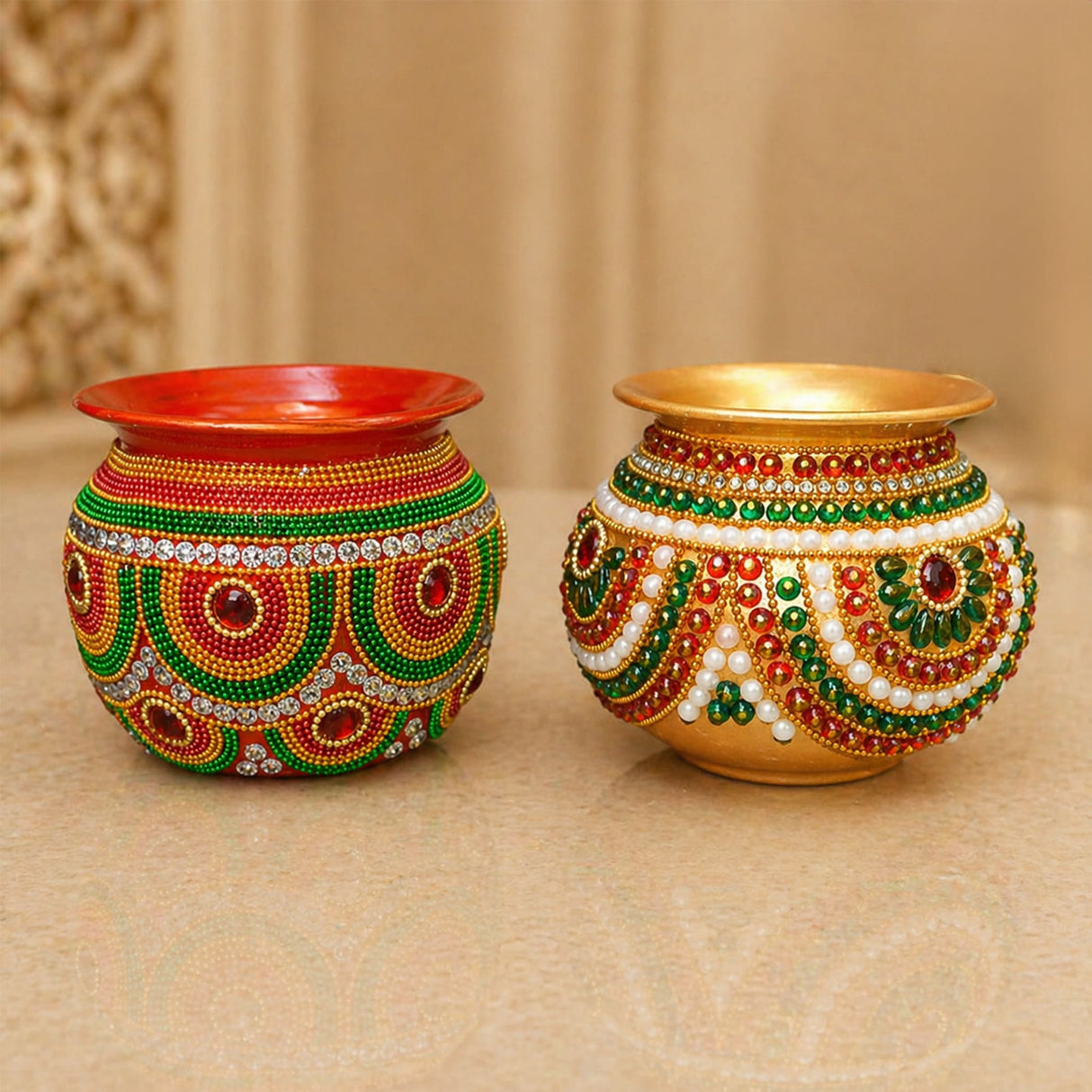 Two ornate hand-decorated mild steel puja kalash pots adorned with red green gold and white beads for festive decor
