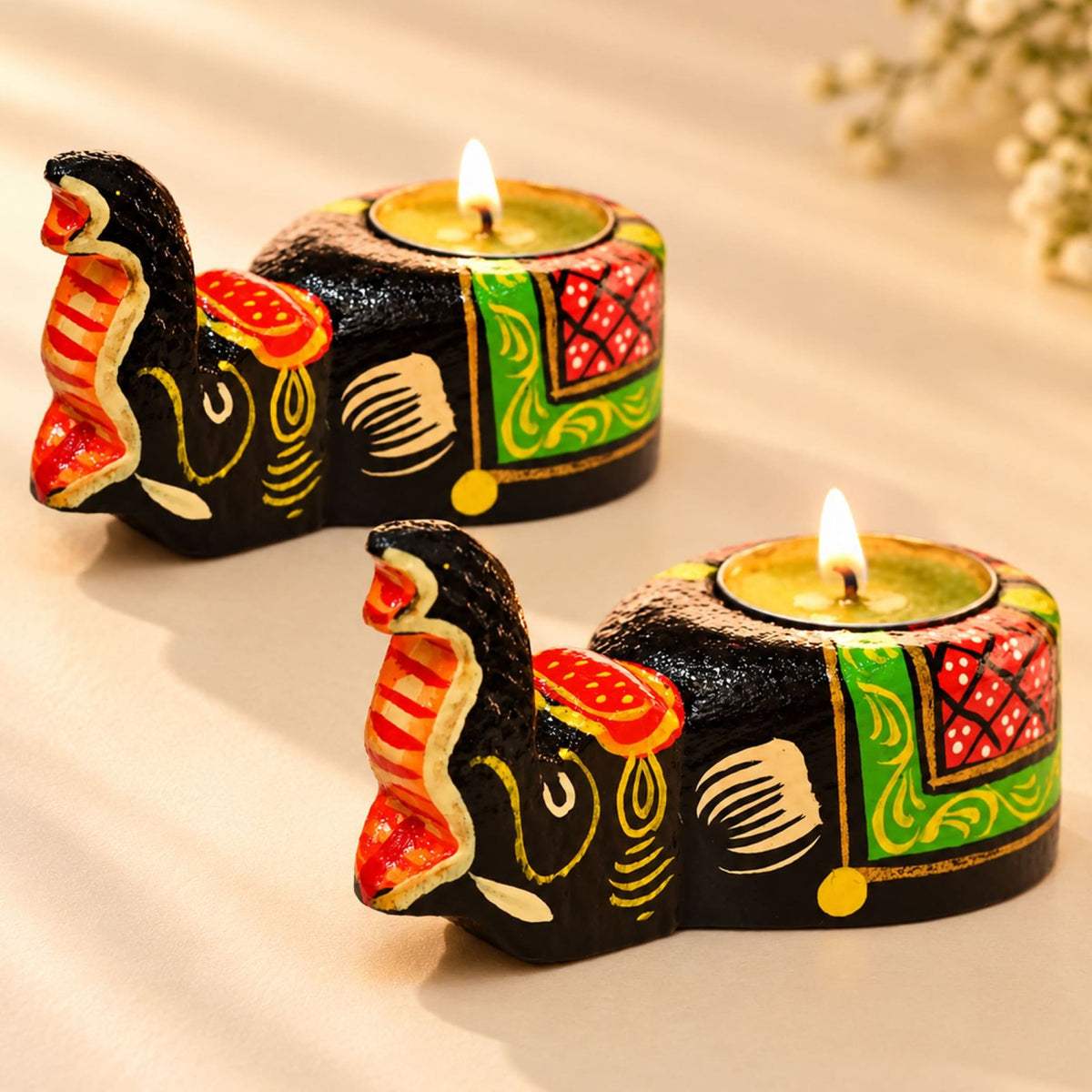 2 pack hand-painted black ceramic elephant tea light candle holders with vibrant red green and gold patterns for home decor