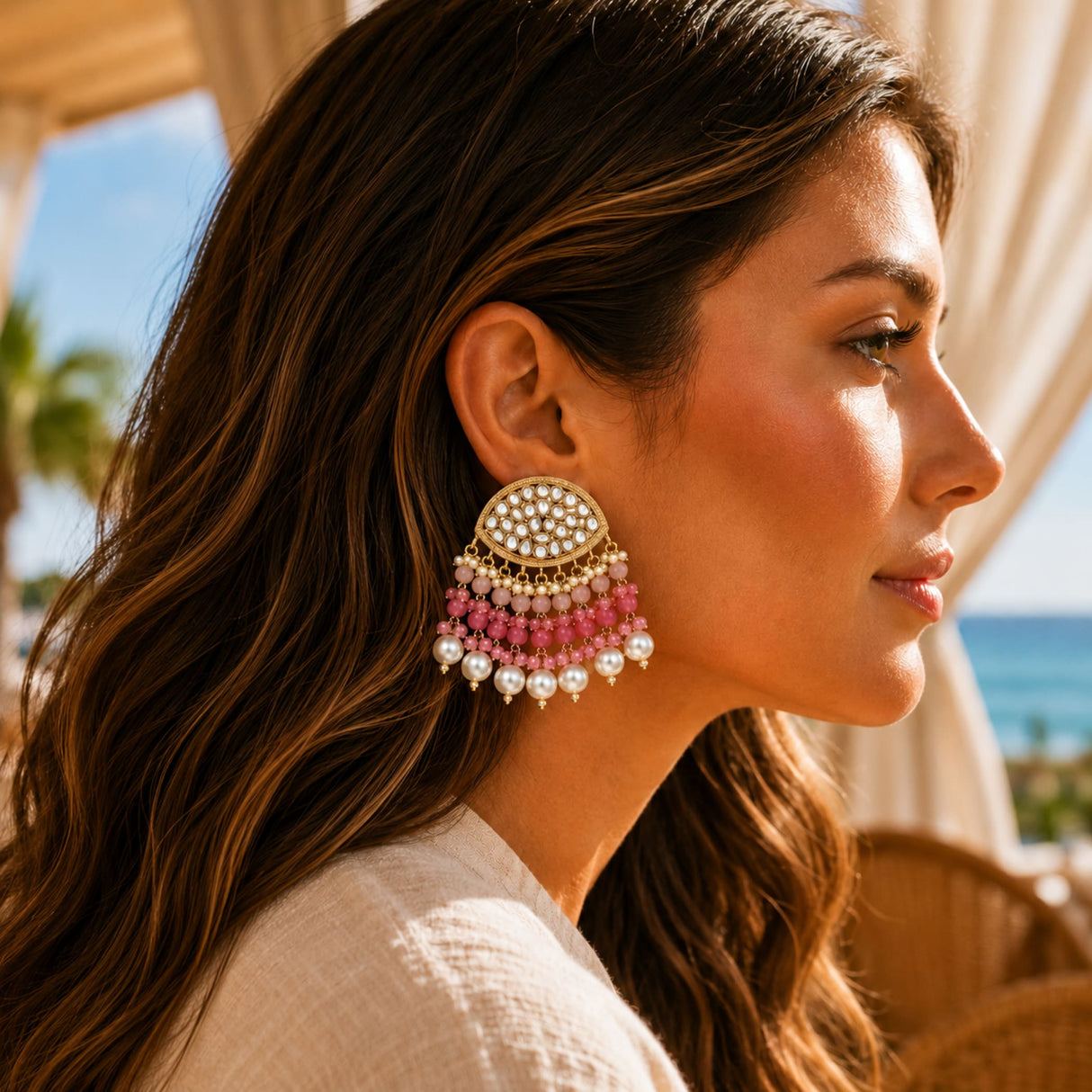 Gold tone indian kundan stone earrings with white stones and pink beads for wedding diwali and ethnic wear