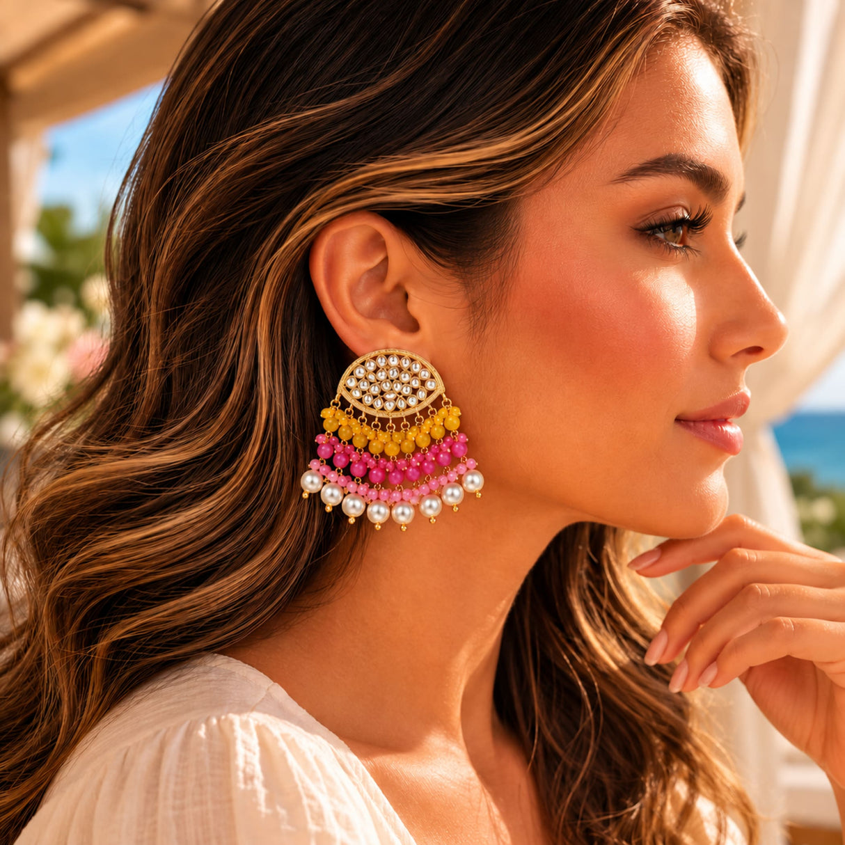 Indian kundan stone and faux pearl vibrant multi-tiered chandelier earrings with gold tone frame and colorful beads for ethnic wear