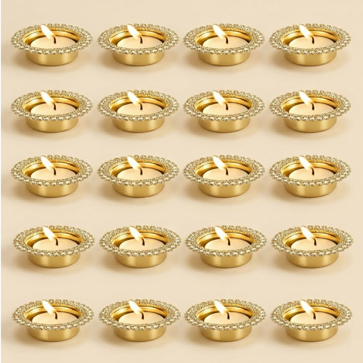 Gold-colored tea light holders with sparkling gemstone-encrusted rims for indian decorative centerpiece and festive decor