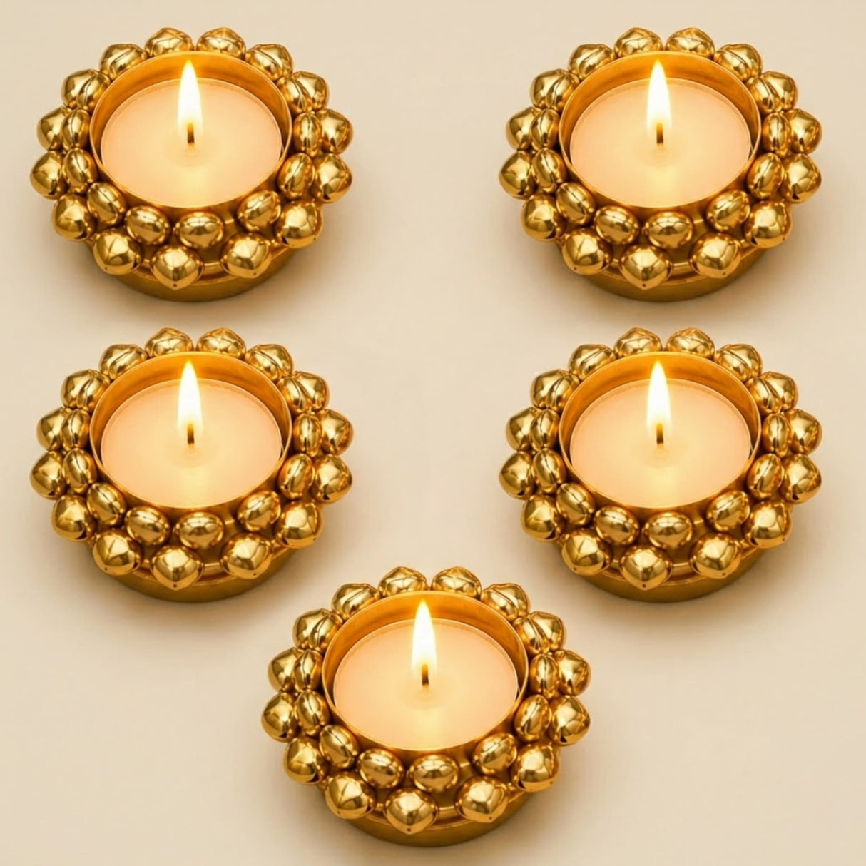 Golden beaded indian tealight candle holders with lit tea light candles for diwali christmas and pooja decor