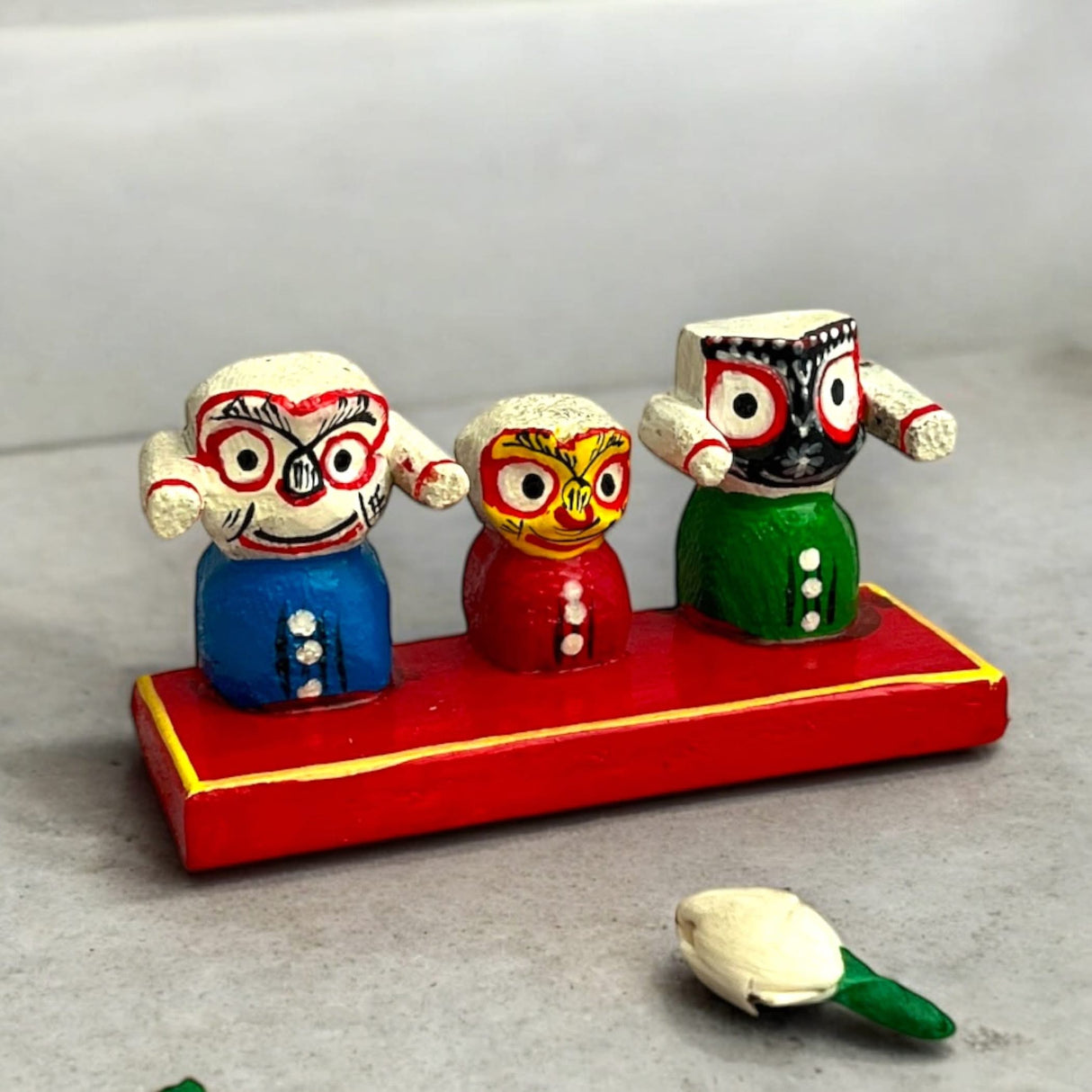 Colorful wooden Jagannath Balabhadra and Subhadra figurines for home decor and puja shows