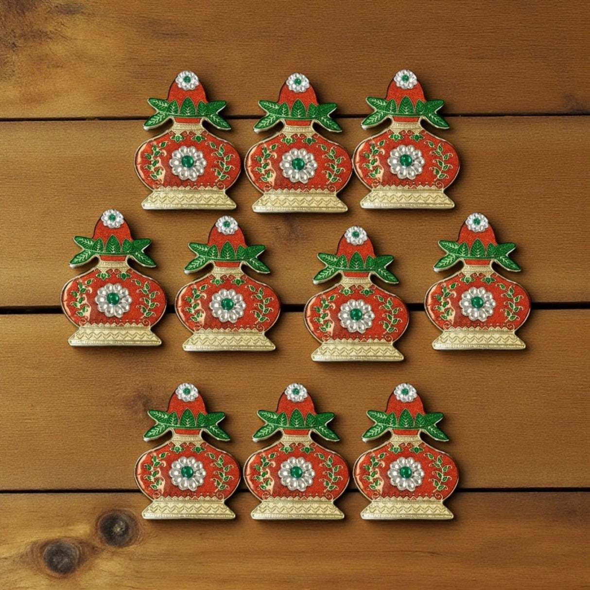 Red and gold ceramic Christmas ornament set with floral patterns for Diwali and Pooja decor