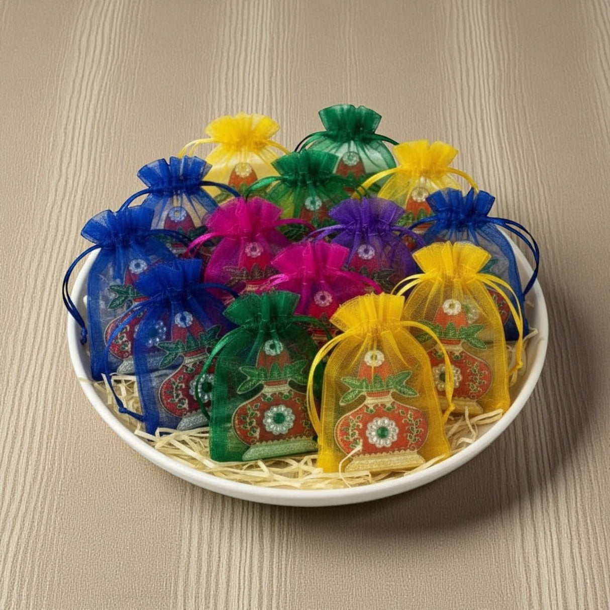 Colorful organza drawstring bags with festive designs and tassels for Diwali and Pooja decor