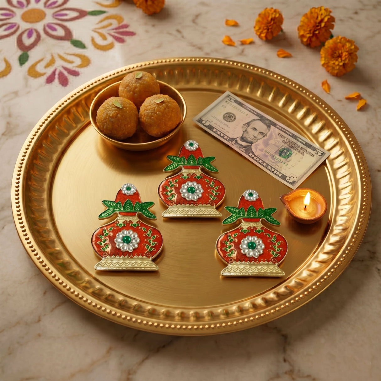 Three ornate red and green kalash haldi kumkum holders with silver embellishments on a golden tray for pooja rituals