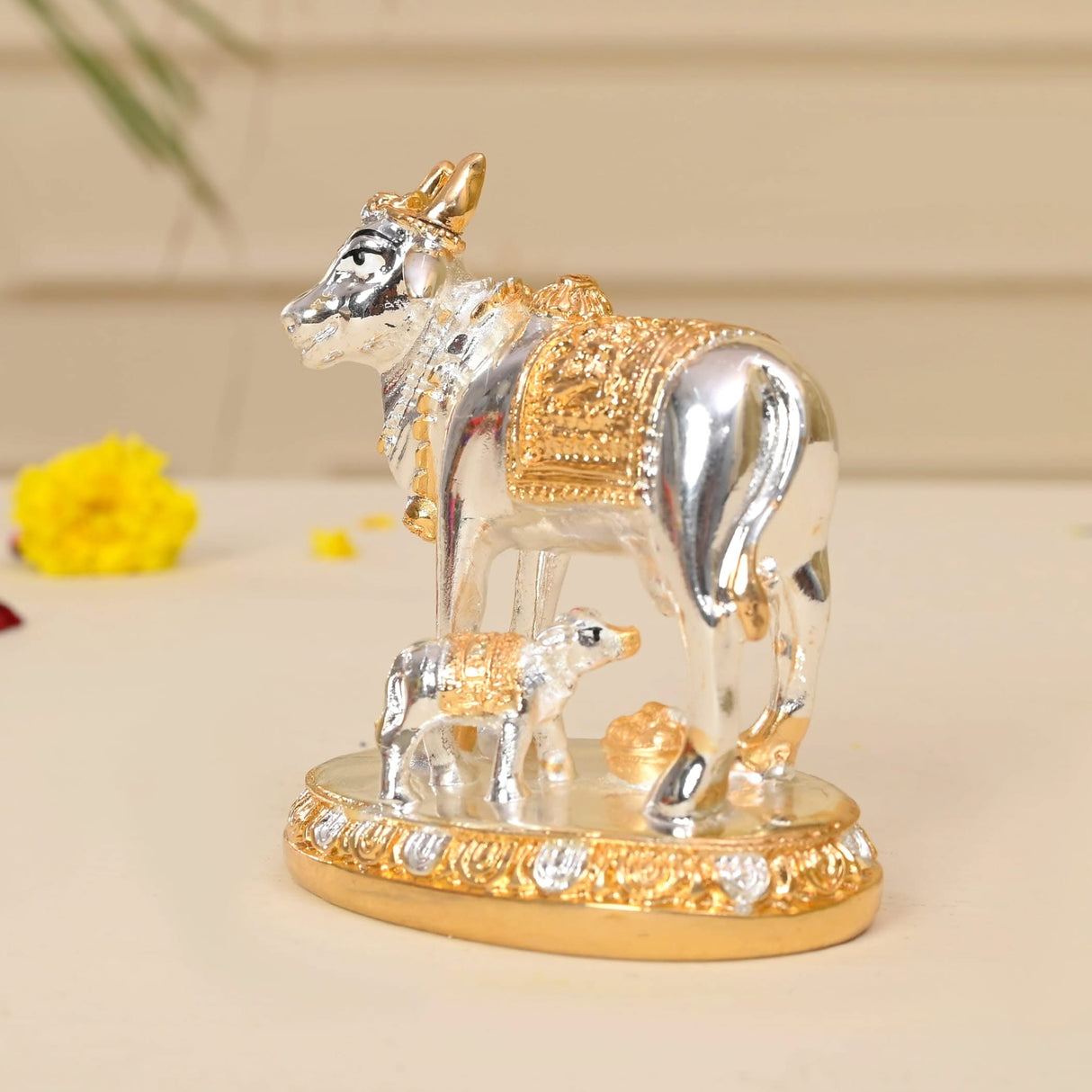 Silver and gold cow and calf figurine for home, temple, or festive decor