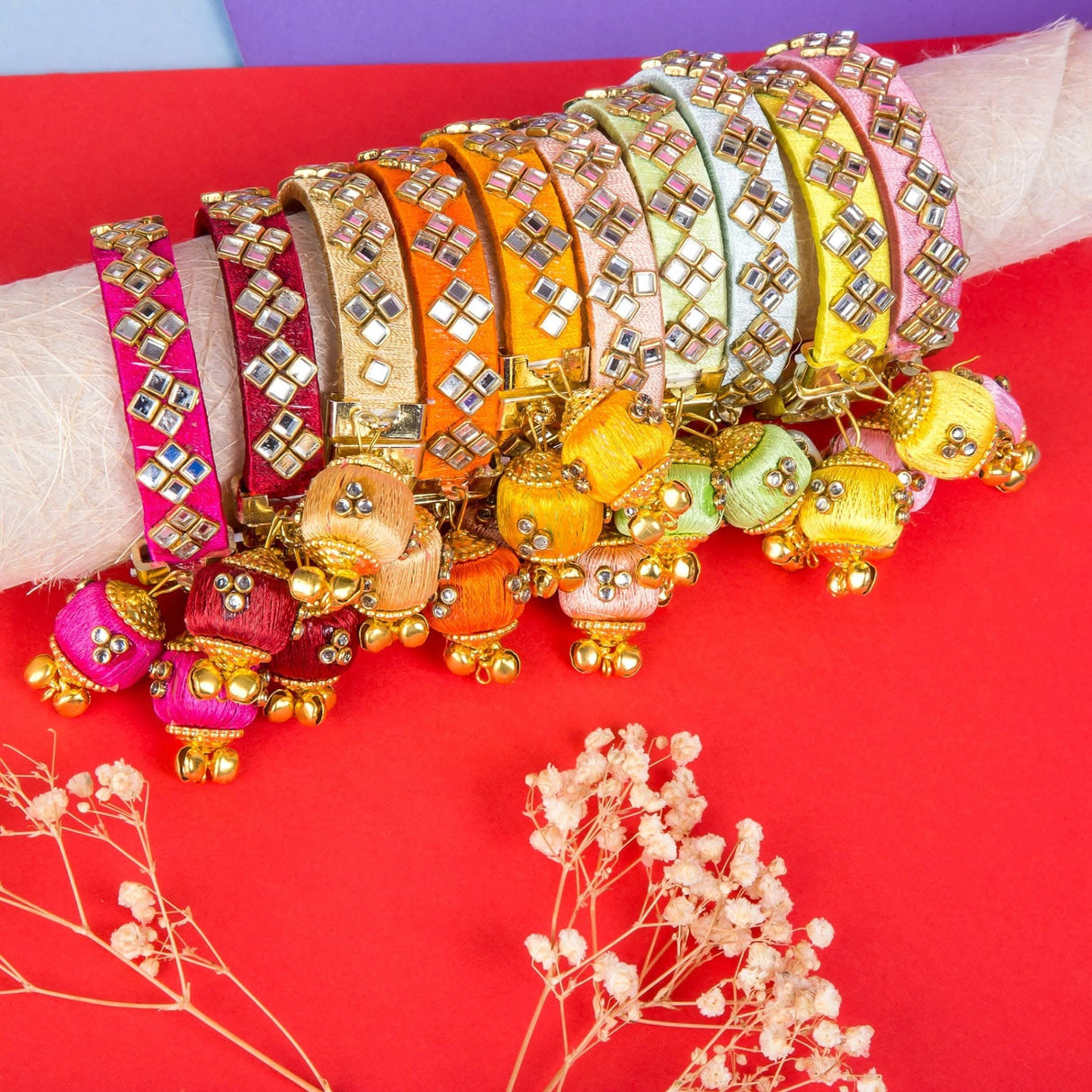 Colorful mirrored bangle set with tassel charms for Karva Chauth and Navaratri celebrations