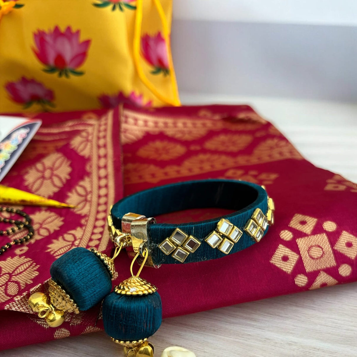 Teal bangle with square mirrors and tassel, ideal for Hindu Puja ceremonies