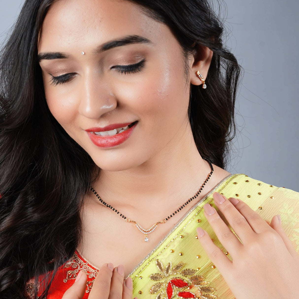 Woman wearing a traditional mangalsutra necklace for Hindu festival celebration