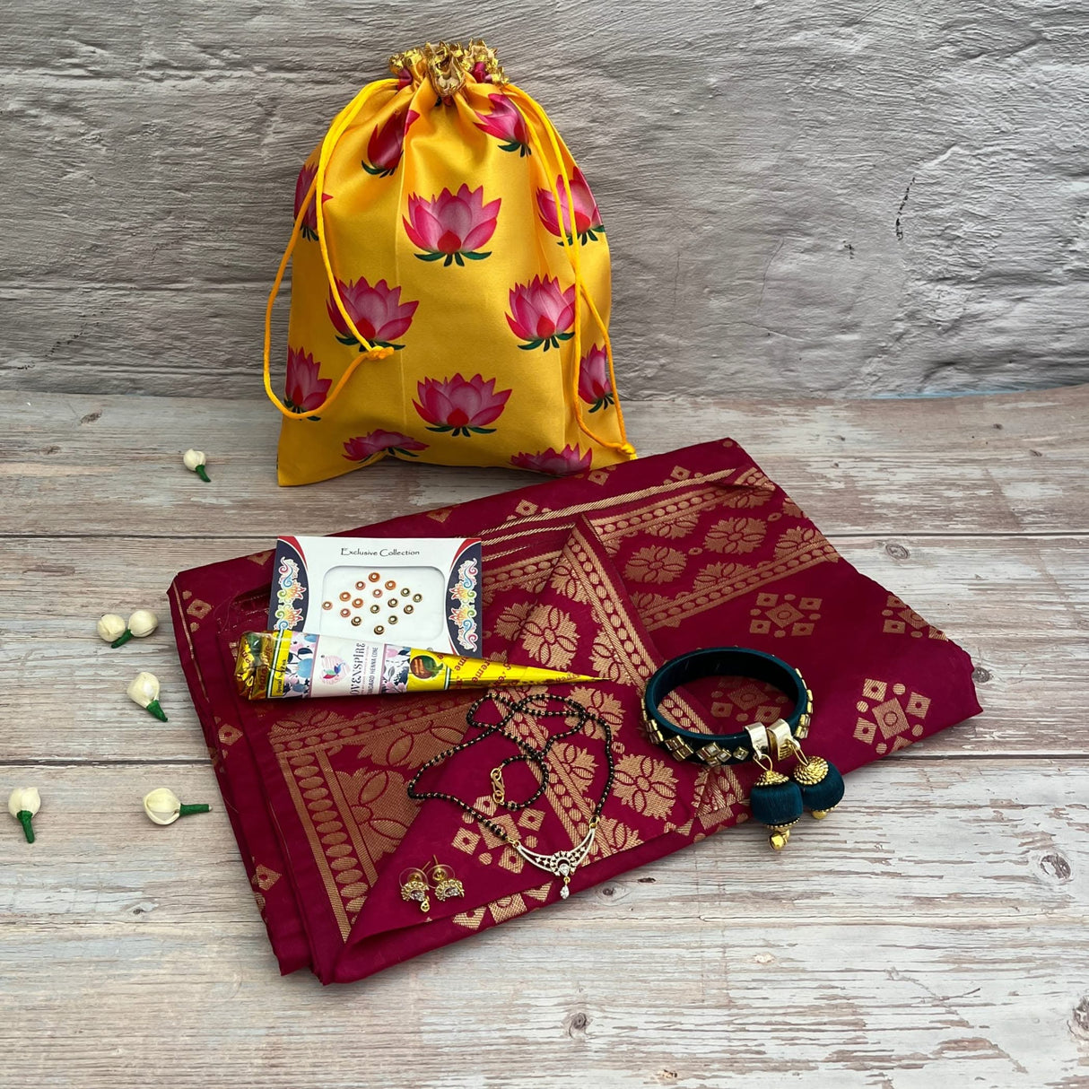 Maroon and gold saree with traditional accessories for Karva Chauth and Navaratri celebrations
