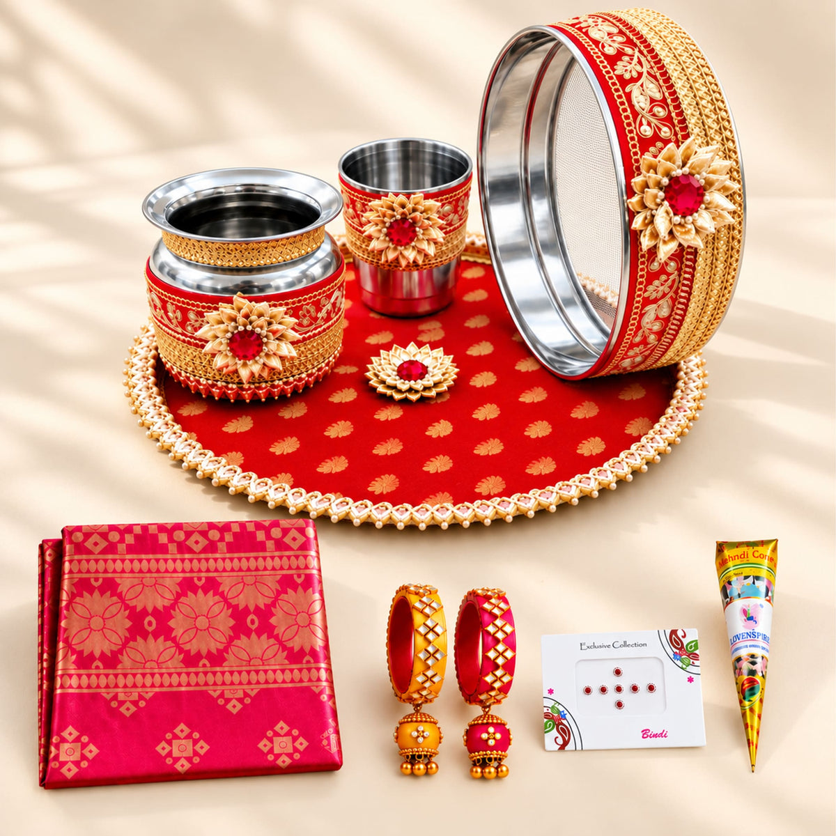 Red and gold ornate karwa chauth pooja thali set with intricate floral designs for traditional festive gifting