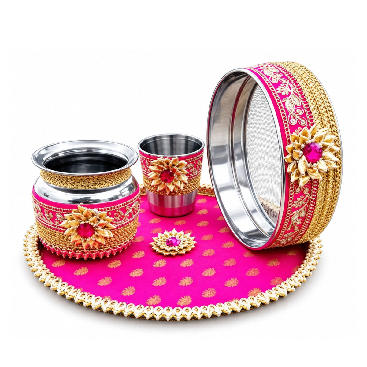 Vibrant pink and gold karwa chauth pooja thali set with metallic accents includes bowl, cup, sieve, and tray