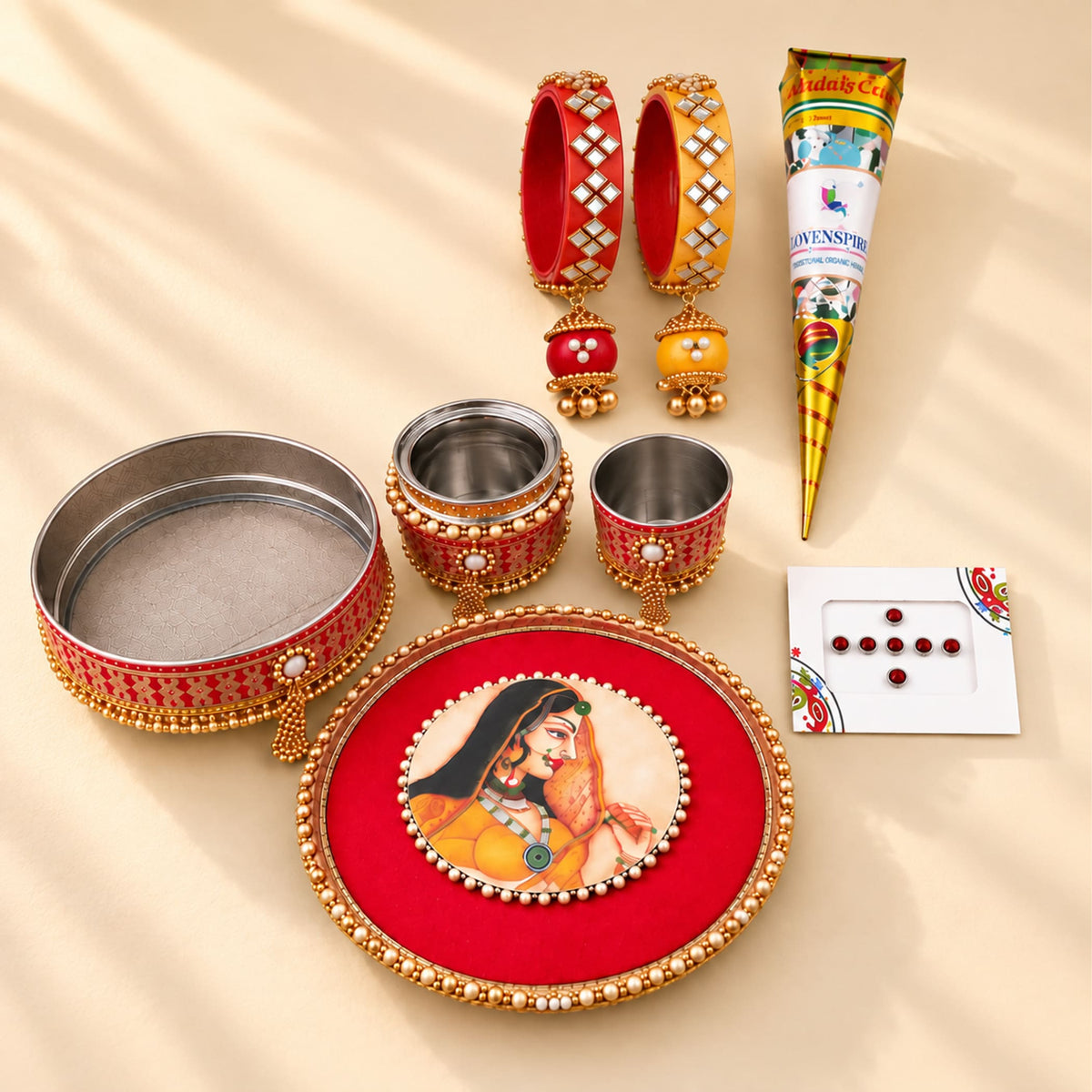 Red and gold beaded karwa chauth pooja thali with ornate woman illustration for traditional festive gifting set