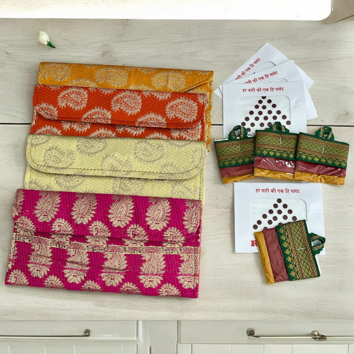 Colorful patterned clutch purses and bindis for Navratri Kanya Pujan gifts