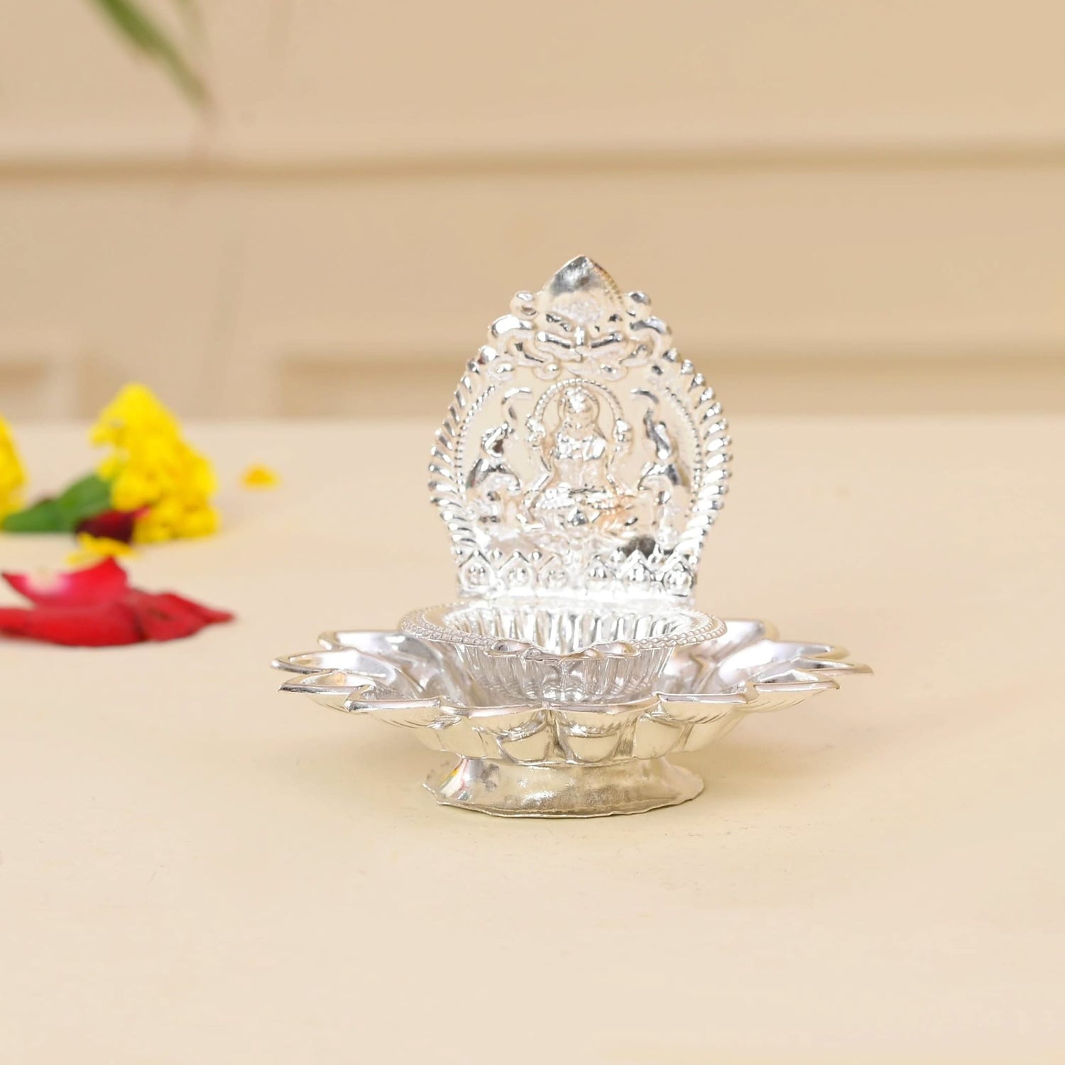 Silver-colored decorative oil lamp for Diwali, Hindu Puja, and home decor celebrations