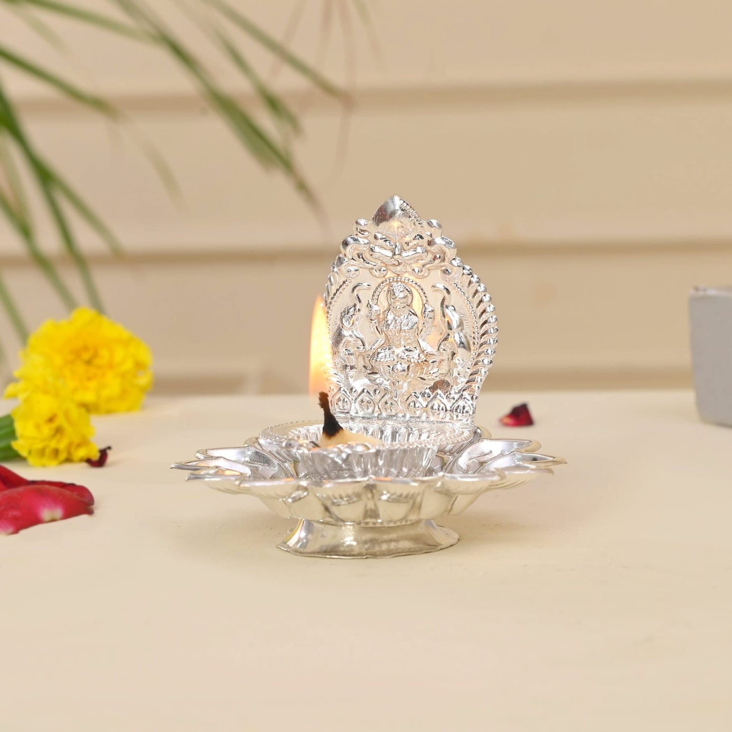 Silver oil lamp with deity design for Diwali, Puja, and religious home decor