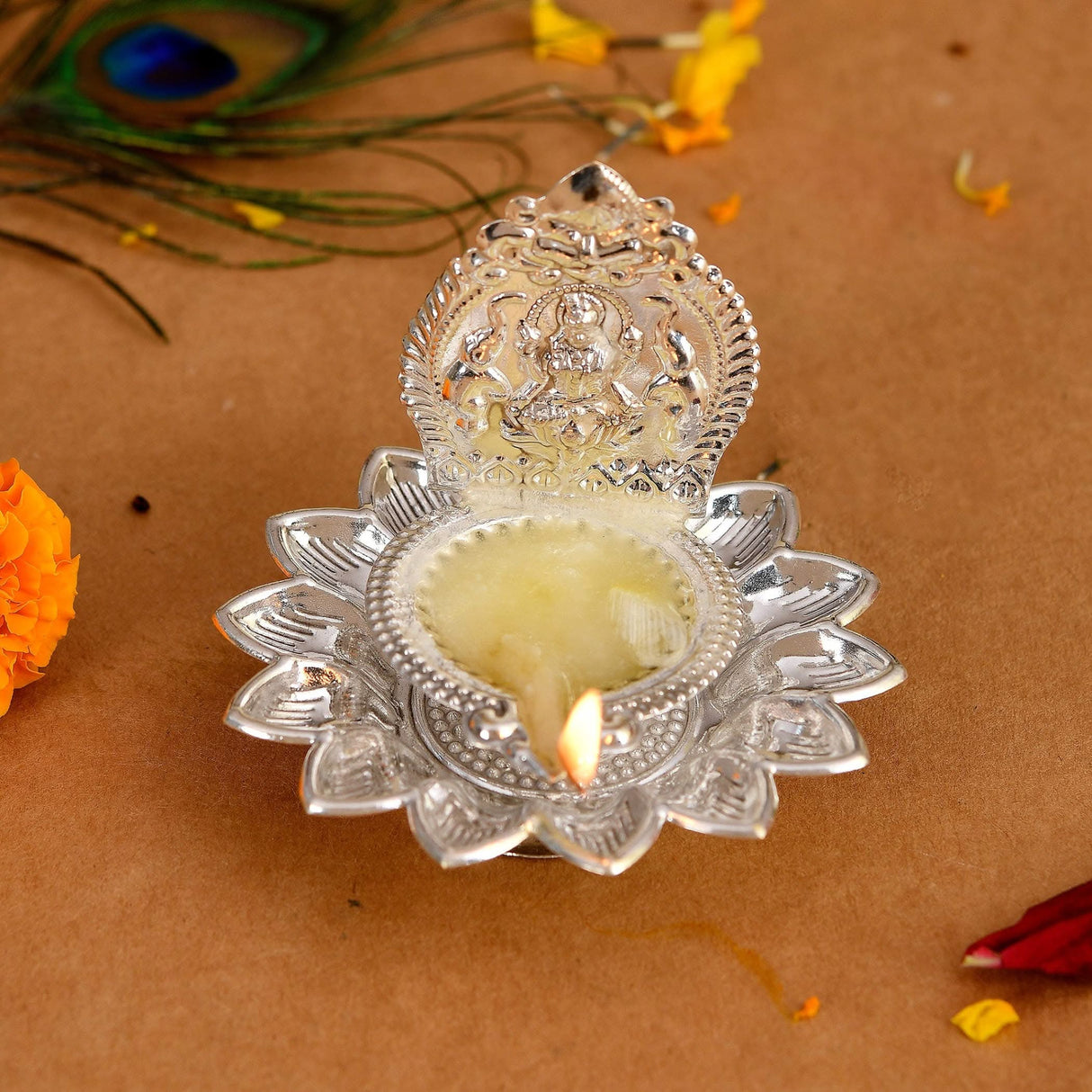 Silver lotus diya with Goddess figure for Diwali Puja and Hindu religious decoration