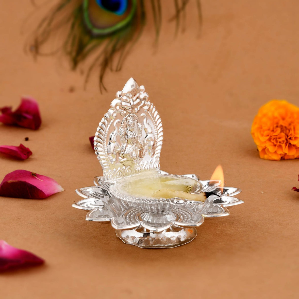 Silver oil lamp with deity for Diwali, Pooja, and Hindu religious home decor