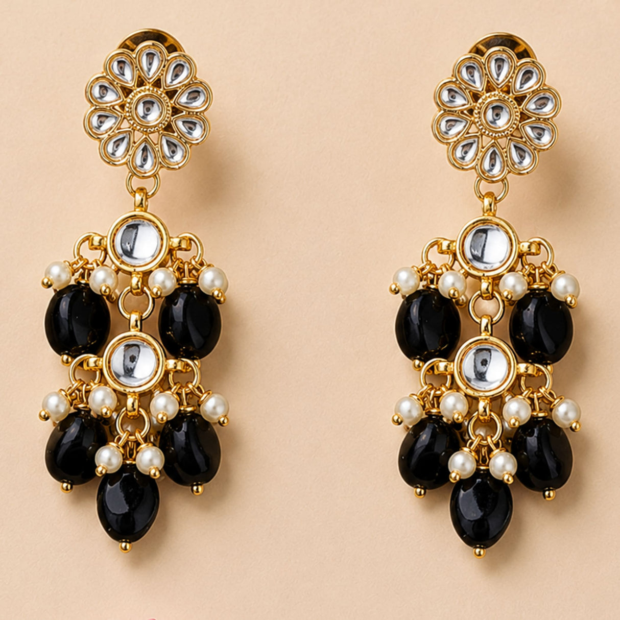 Elegant gold tone Indian floral kundan stone earrings with clear stones black onyx beads and faux pearls for weddings