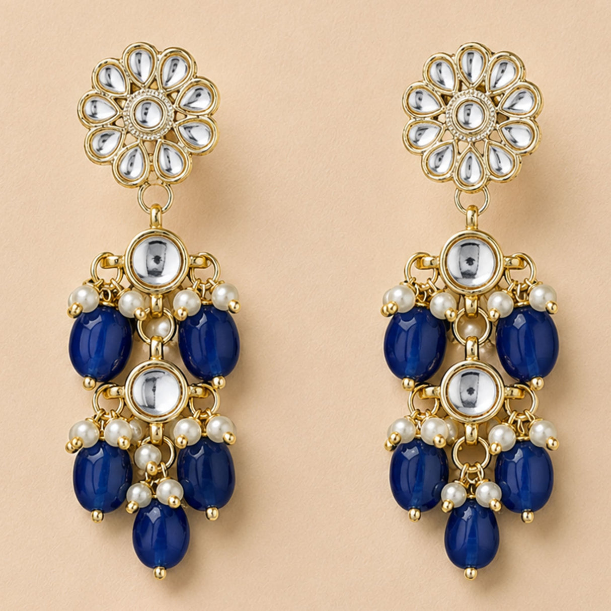 Elegant gold tone Indian floral kundan stone earrings with deep blue beads and white pearls for Diwali and weddings