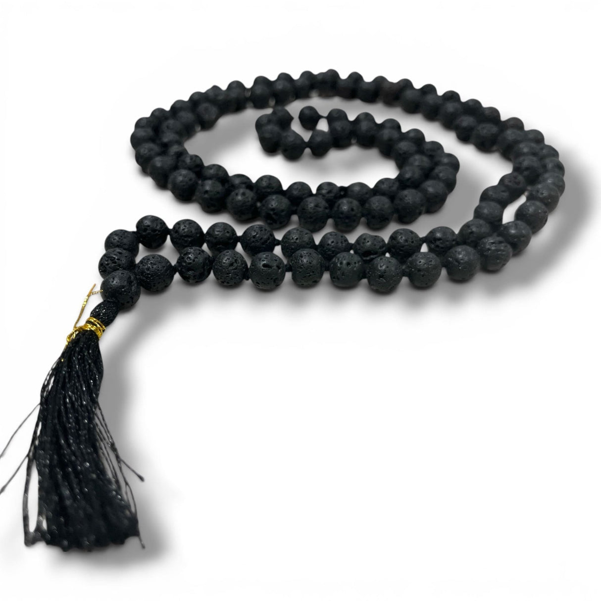 Black lava rock beads mala necklace with gold-toned clasp and black tassel for meditation and yoga prayer use