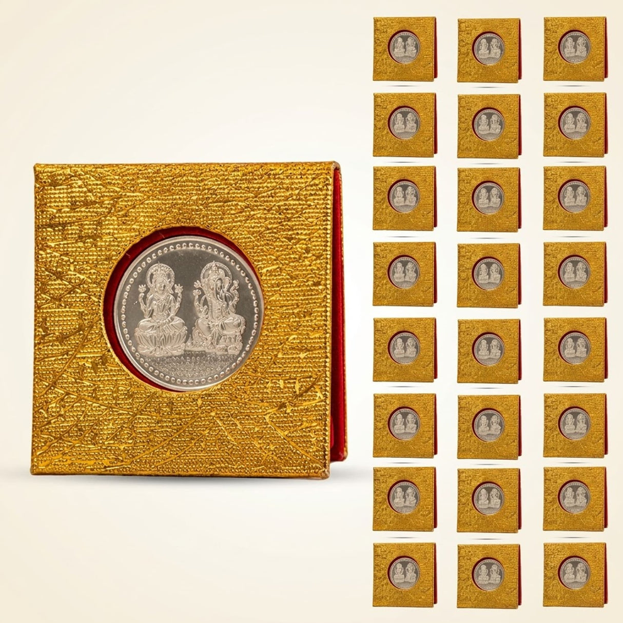 Golden textured coin display case holding a silver plated laxmi ganesh commemorative coin with velvet gift packing for pooja